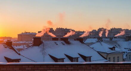 Snow-covered rooftops with chimney smoke at winter sunrise