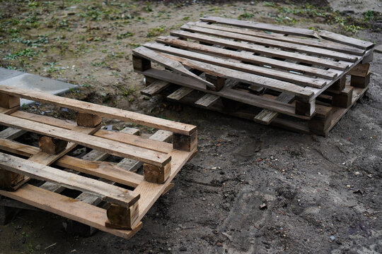 Broken wooden pallets at a construction site