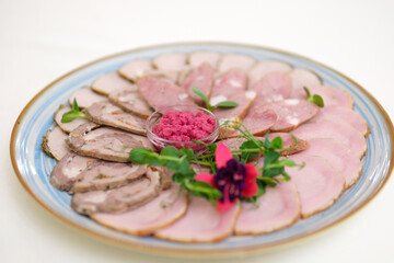 Appetizers with differents antipasti, charcuterie, snacks and red wine. Sausage, ham, tapas, olives and crackers for buffet party. Top view, flat lay. High quality photo