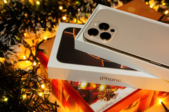 BURGAS, BULGARIA - NOVEMBER 28, 2025: Apple iPhone 16 Pro Max Desert Titanium on Christmas background. iPhone Christmas gift