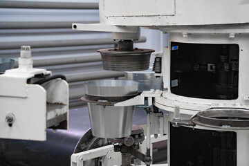 areas for the production of tableware made of sheet iron, buckets for water, conveyor belt