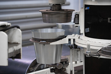 areas for the production of tableware made of sheet iron, buckets for water, conveyor belt