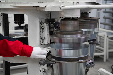 areas for the production of tableware made of sheet iron, buckets for water, conveyor belt