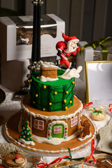 Santa-on-Chimney Christmas Cake with Gingerbread House Base