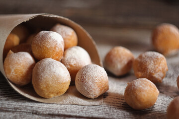 Fritule - Croatian mini doughnuts. Selective focus
