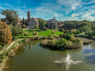 Fototapeta premium Aerial view of Our Lady of Victory chapel, library, Coeur de Catherine, Dewdrop pond at St. Catherine University Saint Paul, Minnesota