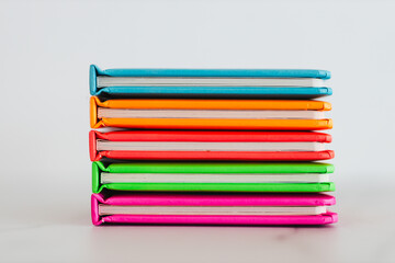 colourful children books on minimalist setup, concept of learning to read and early education