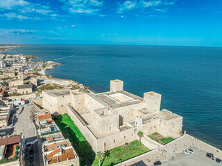 Aerial view of norman seaside castle of Trani built with white stone in Puglia Italy