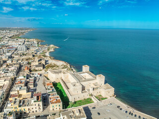 Aerial View of Trani: The Medieval Swabian Castle, Historic Old Town, and Vibrant Fishing Port along the Adriatic Coastline