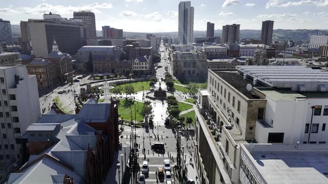 Drone flies west along WF Nkomo Street over Church Square on sunny day in Pretoria, South Africa
