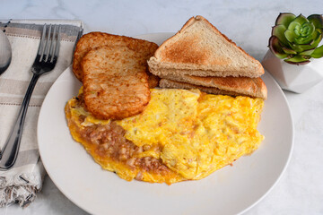 corn beef hash omelette with hash browns