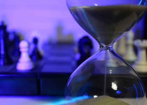 Hourglass and chess onthe chess board timer and game 