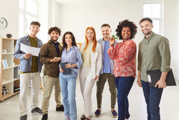 Portrait of a diverse and multiethnic group of students and colleagues in an office, showcasing...
