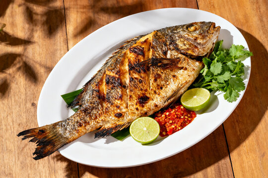 delicious grilled dorado or sea bream fish with lemon.