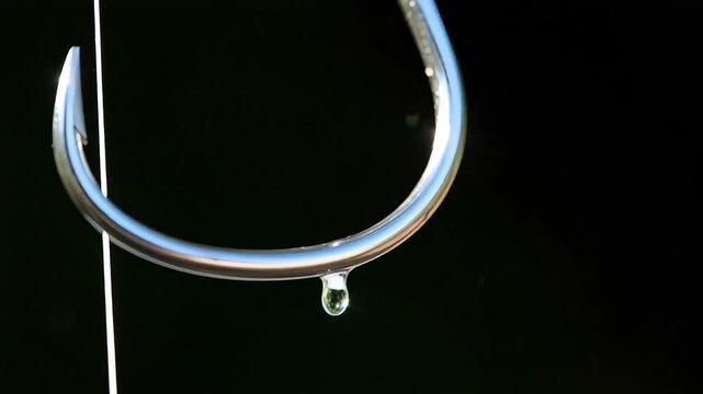 Extreme close up of a shiny silver fishing hook