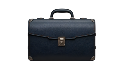 A dark blue leather briefcase with a silver latch and handle isolated on a black background studio shot