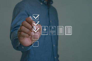 Businessman mark off items on digital checklist, representing quality assurance and document...