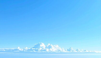 Wisps of pure white clouds on the horizon, creating a calm and peaceful backdrop with plenty of empty space for text or design.winter mountain landscape