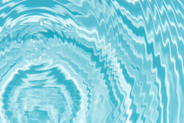 Blue water with ripples on the surface. Defocus blurred transparent blue colored clear calm water surface texture with splashes and bubbles. Water waves with shining pattern texture background.