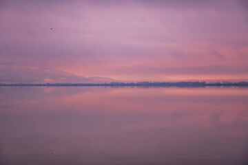 Pastel Sunrise Over Calm Lake