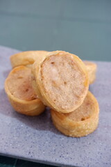 Crispy chicken egg rolls sliced and displayed on a speckled plate, perfect for appetizer, catering, or food content.