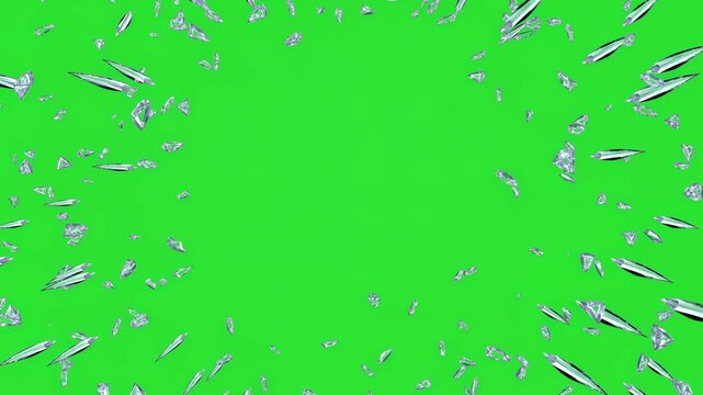 Glass shards exploding outward on green background. Chromakey effect of broken mirror or ice for visual design. Overlay video element.