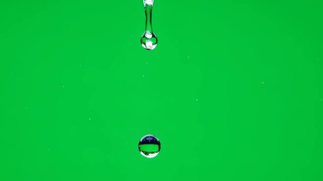 Water drop falling down frame by frame on a green screen for special effect