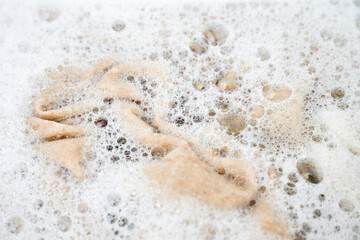 Cashmere Wool Sweater Being Hand Washed with Delicate Detergent