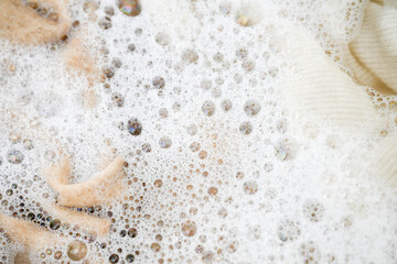 Cashmere Wool Sweater Being Hand Washed with Delicate Detergent