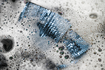 Blue Sparkly Dress Being Hand Washed with Delicate Detergent