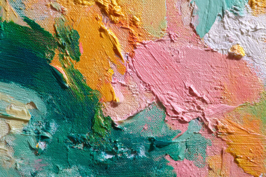 A textured abstract painting with thick impasto strokes in vibrant shades of green yellow and pink
