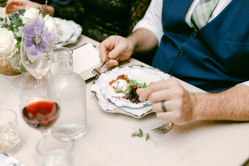 Elegant dining experience at a formal gathering with gourmet dishes and fine wine