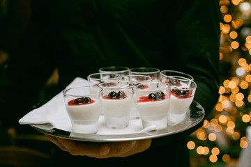 Delicious desserts served on a tray during a festive celebration in a cozy setting