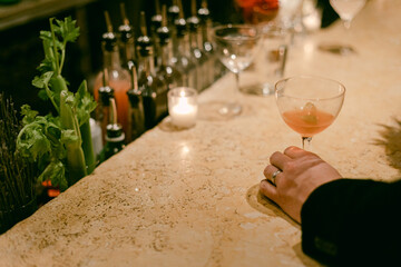 Enjoying a cocktail at a stylish bar with a cozy atmosphere during a night out