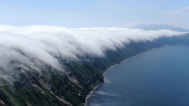 Flight over the caldera of the extinct volcano Lion's Mouth, Iturup Island, Kuril Islands