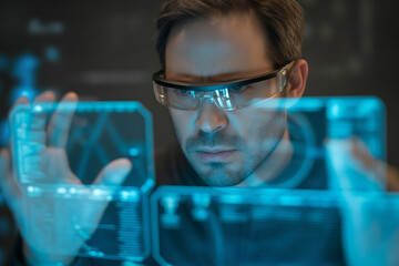Man in futuristic glasses interacting with a holographic digital interface