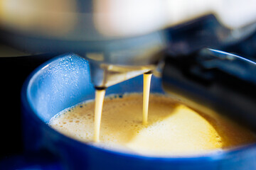 Coffee Machine brewing an espresso in a cup