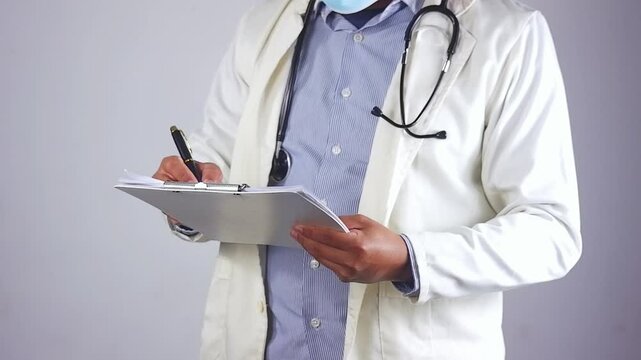 Person, dokter, nurse and hands writing with document for medical prescription, patient records or inusrance at hospital. closeup or doctor with notes or filling health form, survey or application
