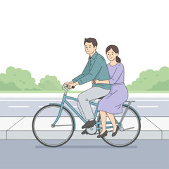 Joyful couple cycling together on a bright day, embracing the freedom of an outdoor adventure and shared moments