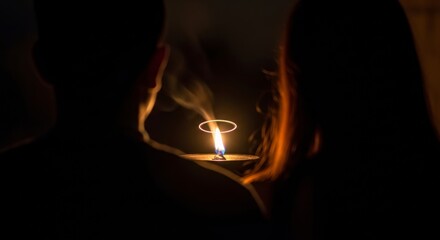 Mystical moment with a single flame and a smoke ring in darkness creating a serene and