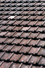 Macro Texture of Overlapping Weathered Brown Terracotta Roof Tiles