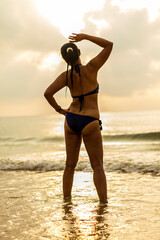 Woman with sunrise and silhouette