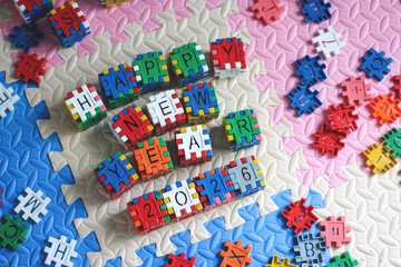 Overhead View of Happy New Year 2026 Message Built with Interlocking Blocks