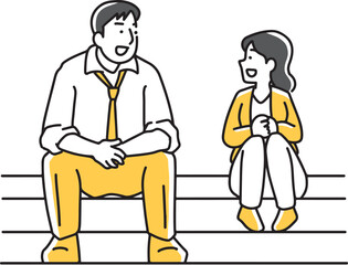 階段に座って話をする男女