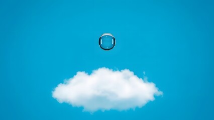 A solitary water droplet poised above a fluffy cloud against a bright blue sky backdrop