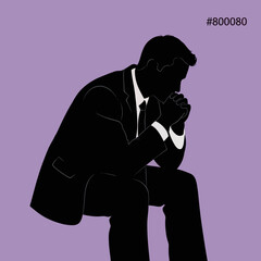 Silhouette of a thoughtful businessman in deep contemplation.