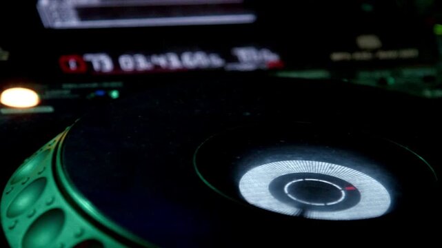 Close up of dj playing party music modern cd player in disco club Nightlife entertainment concept.
