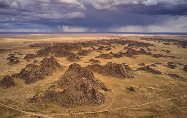 Aerial view of dramatic rock formations in an arid landscape