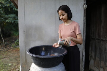 Woman doing laundry in the morning.