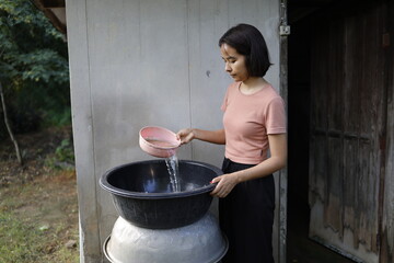 Woman doing laundry in the morning.